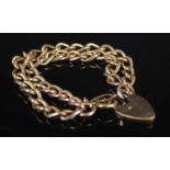 A 9ct gold double chain bracelet, with heart-shaped lock, approximately 17cm long, gross weight 36.2