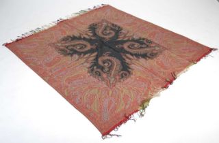 A 19th century black ground paisley shawl, worked in red, blue and green coloured threads,