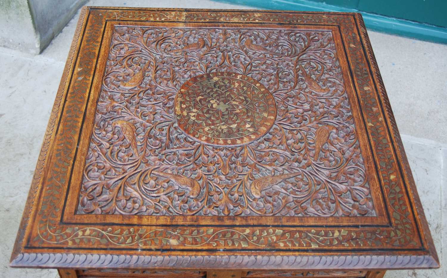 A late 19th / early 20th century Indian carved wood and brass inlaid occasional table, the - Image 2 of 7