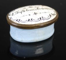 An 18th century Battersea enamel oval patch box, the hinged cover inscribed 'A Trifle from