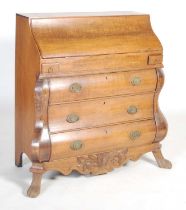 A late 18th century Dutch oak bombe bureau, the serpentine fall-front opening to a fitted interior