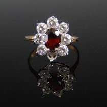 A 9ct gold almandine garnet and rare-earth synthetic garnet, in imitation of diamond, cluster