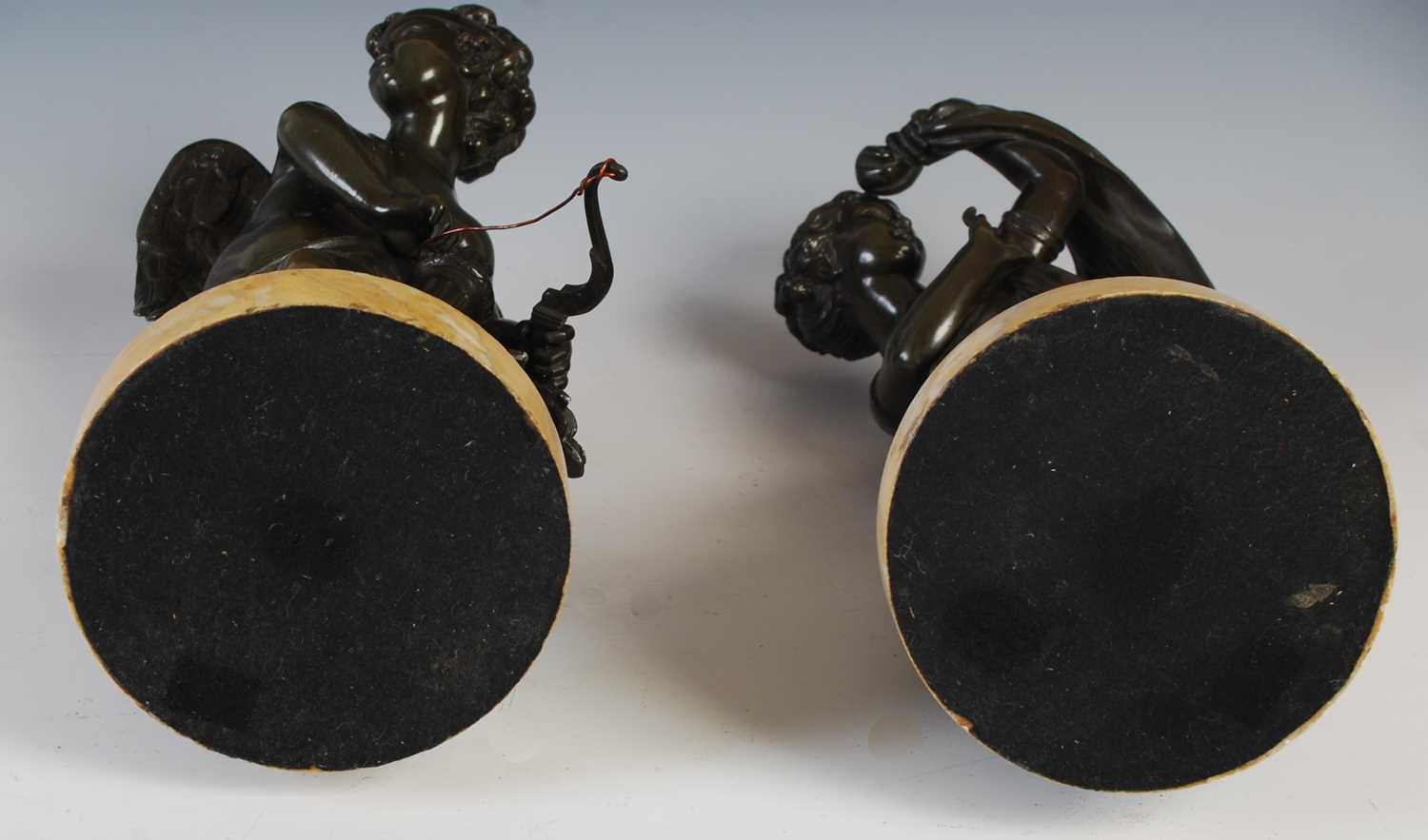 A pair of French bronze models of Cupid and a young girl, probably Psyche, in the manner of Louis- - Image 5 of 5