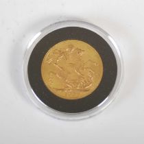A George V gold sovereign, dated 1928.