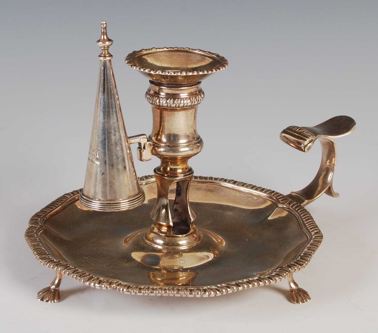 A George III silver chamber candlestick, London 1767, makers mark 'E.C' for Ebenezer Coker, engraved