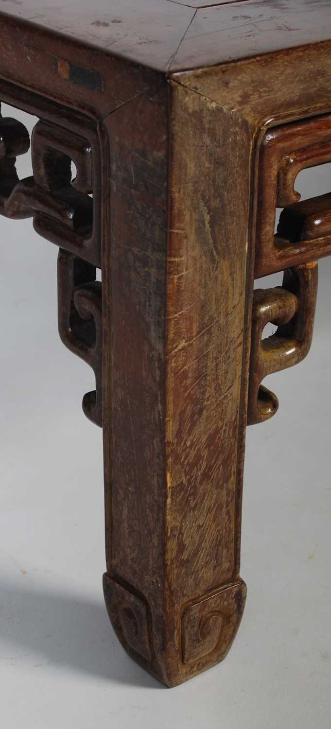 A Chinese dark wood Kang table, late 19th/ early 20th century, the rectangular panel top above a - Image 3 of 5