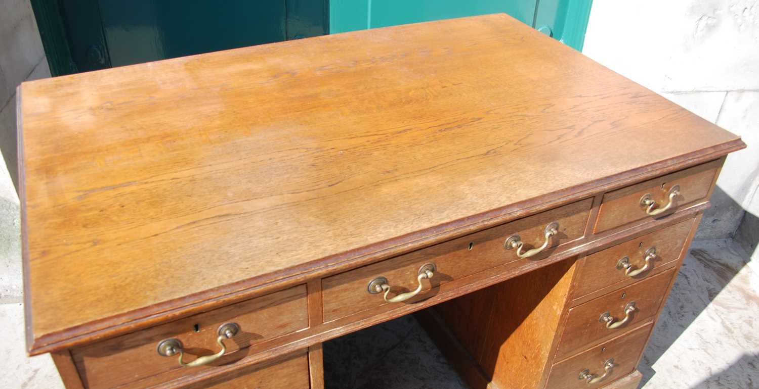 A late 19th century oak pedestal desk, the rectangular top with a moulded edge over a central frieze - Image 2 of 8