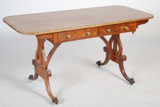 A Regency style mahogany and coromandel centre table, the rounded rectangular top above two frieze