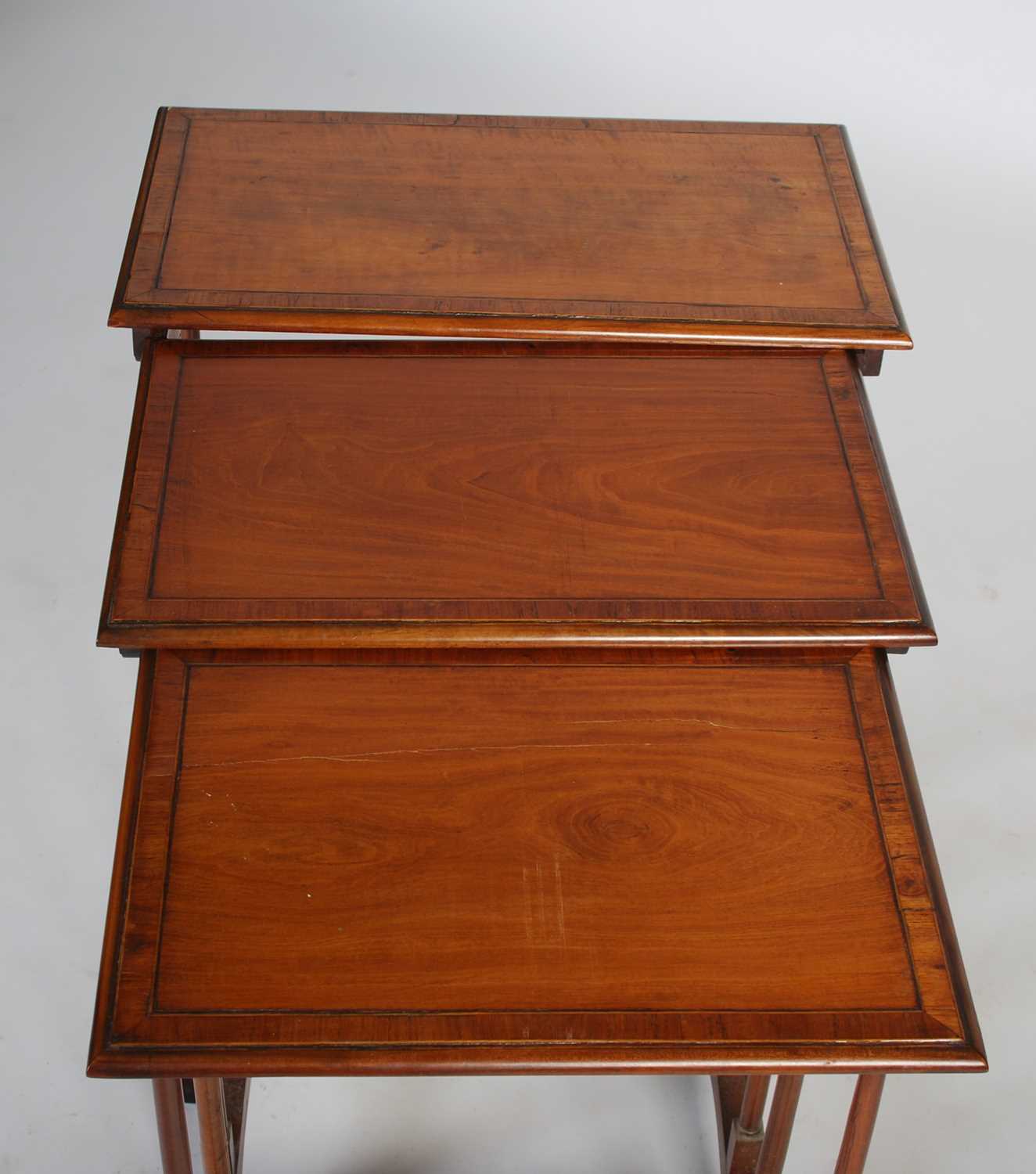 A nest of three George III style satinwood and rosewood banded occasional tables, the rectangular - Image 2 of 5