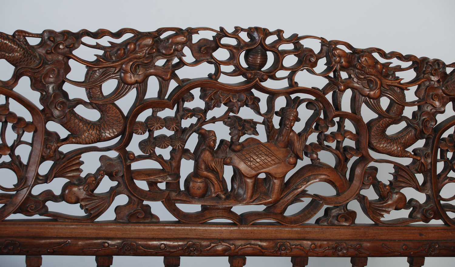 A Chinese dark wood bench, late 19th/ early 20th century, the rectangular back carved and pierced - Image 4 of 6