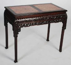 A Chinese dark wood centre table, late Qing Dynasty, the rectangular top with two mottled red