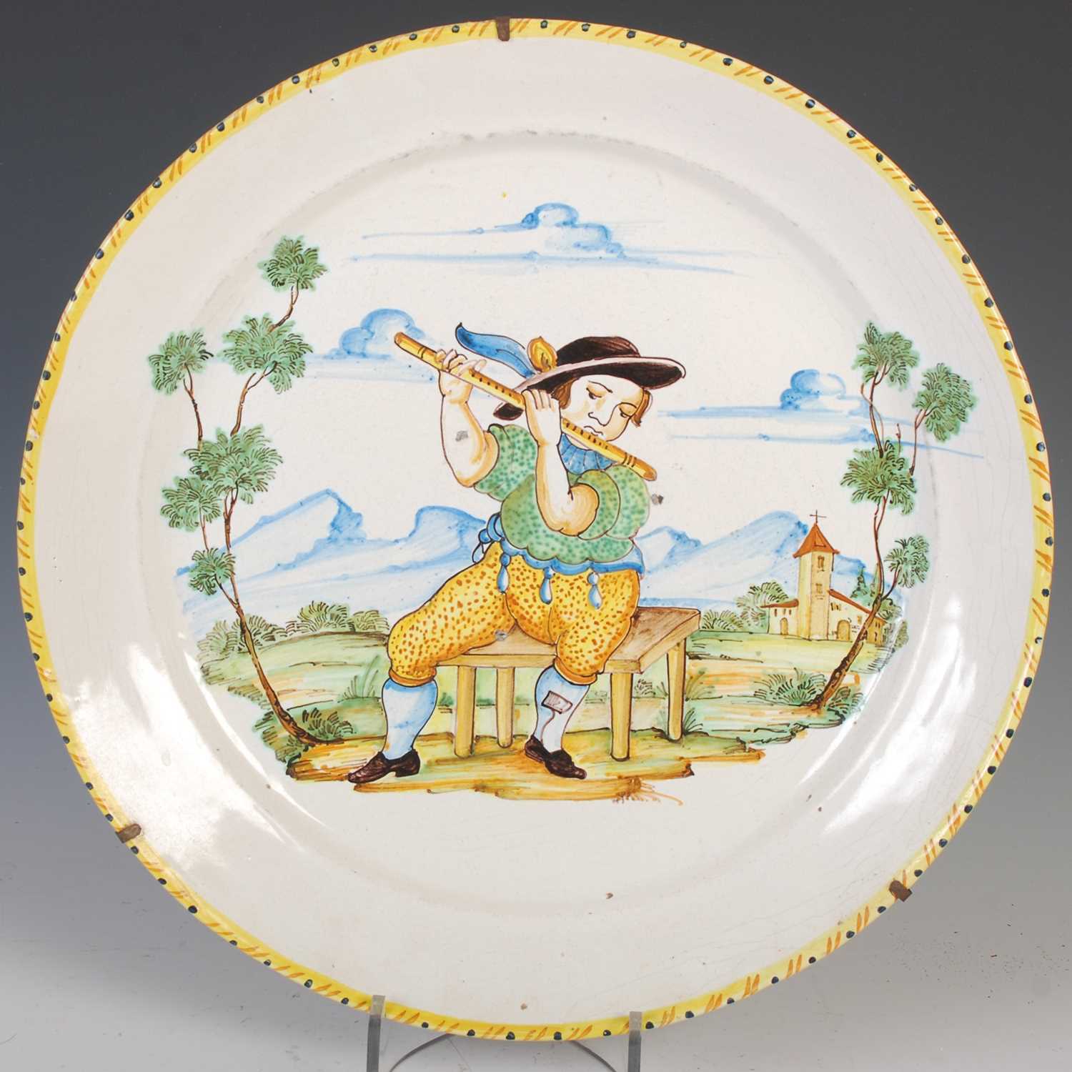 A pair of Italian pottery chargers, late 19th/ early 20th century, decorated with musicians, 38cm - Image 3 of 4