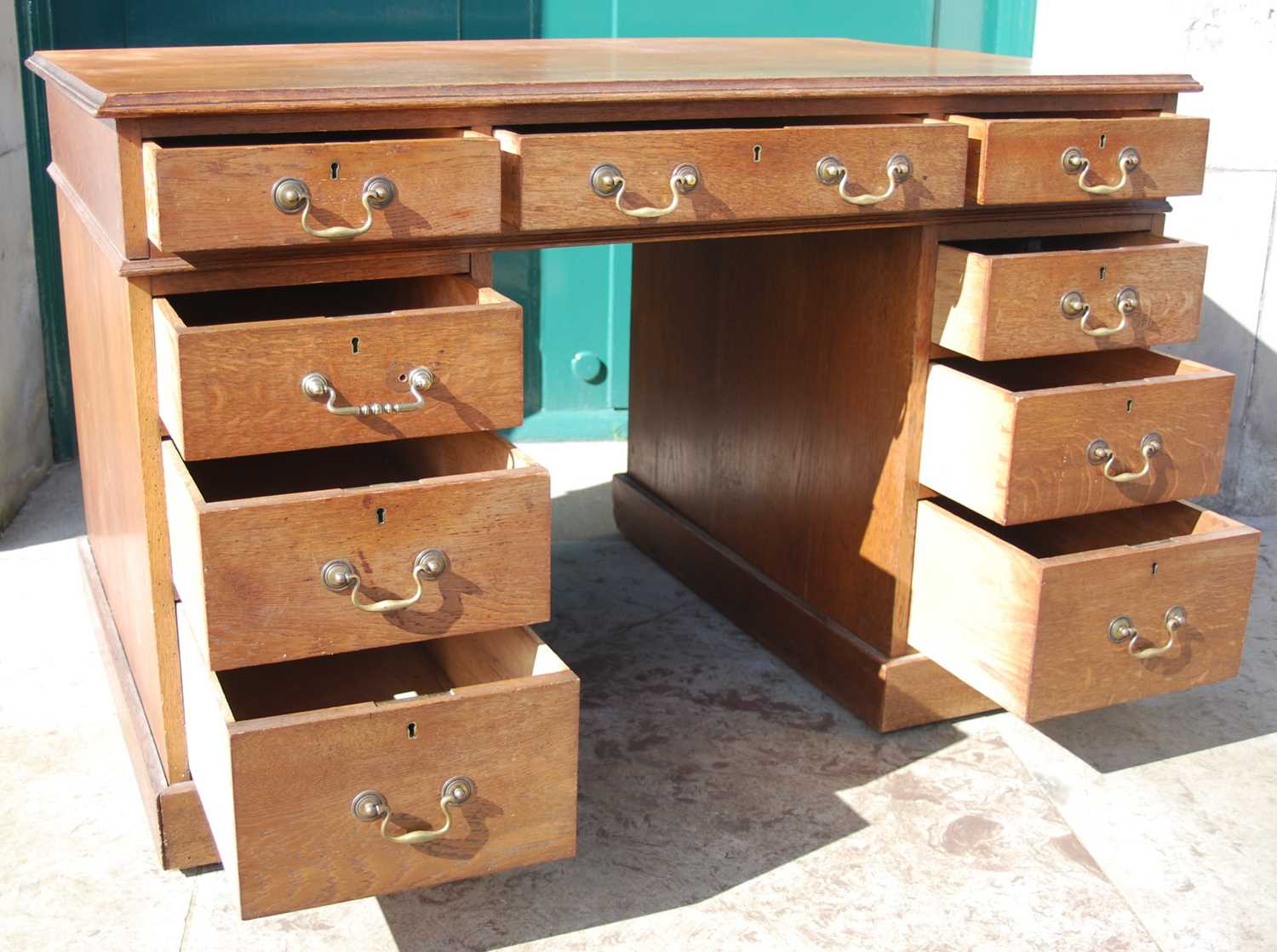 A late 19th century oak pedestal desk, the rectangular top with a moulded edge over a central frieze - Image 3 of 8