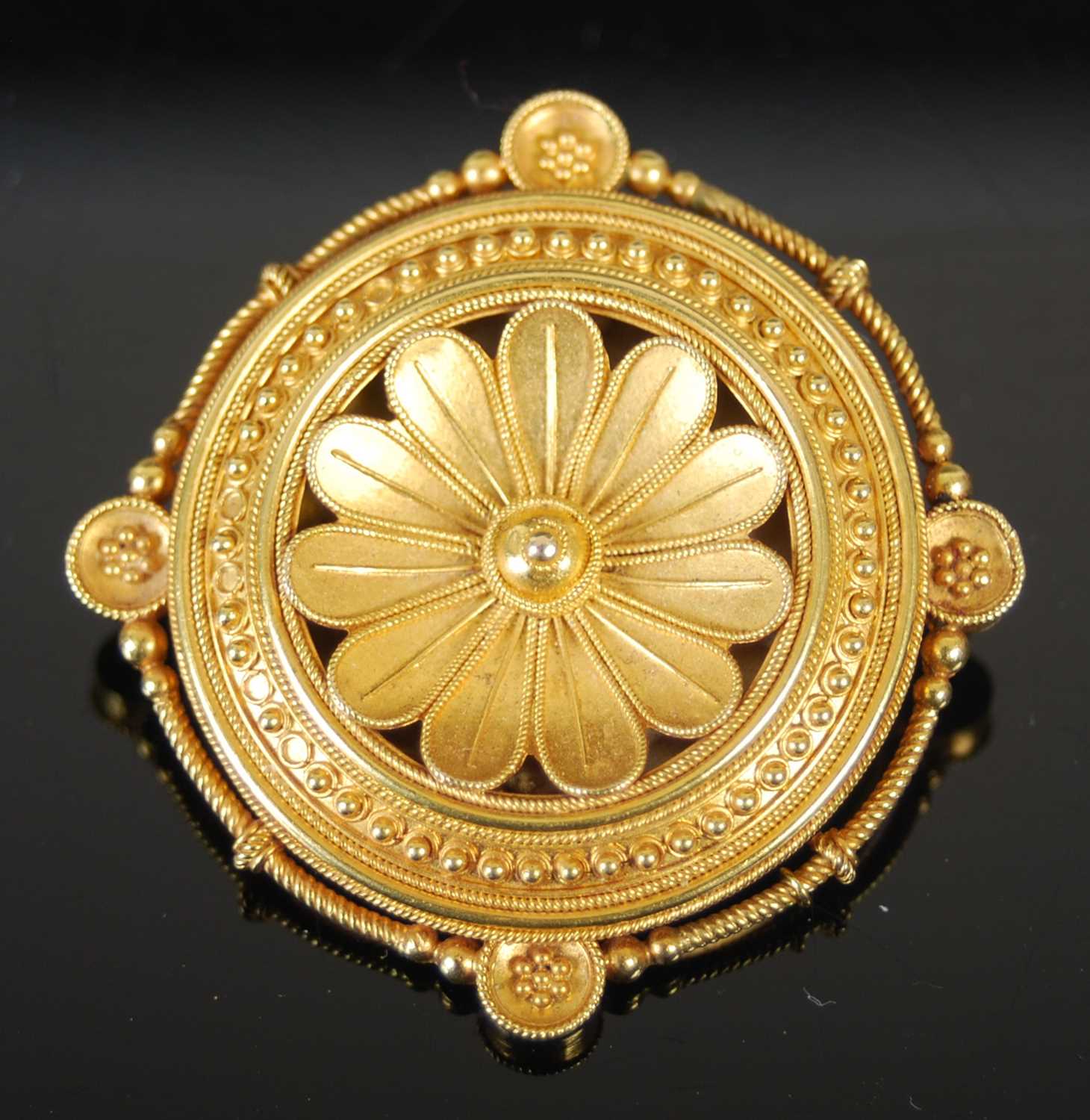 A late 19th century yellow metal locket brooch, centred with a stylised flower, the reverse with - Image 2 of 4