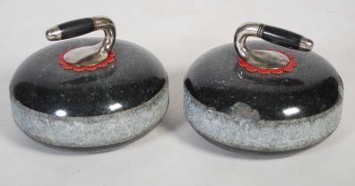 A pair of Crieff Blackstone curling stones with silvered coloured handles.