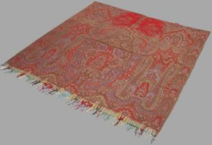 A 19th century red and green ground Paisley shawl, worked in blue, red and green coloured threads,