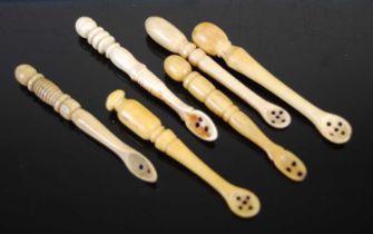 A group of six Scottish bone snuff spoons of various shapes and sizes, with carved turned baluster