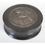 A black pressed horn circular snuff box, the pull-off cover inset with lead medallion with a