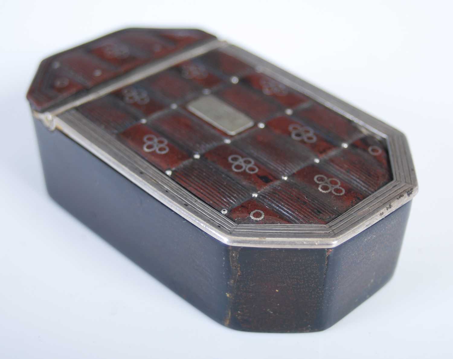 A pressed leather cut-cornered oblong snuff box with silver mounts and three-quarter opening