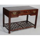 A Chinese dark wood side table/ dressing table, early 20th century, the rectangular panelled top