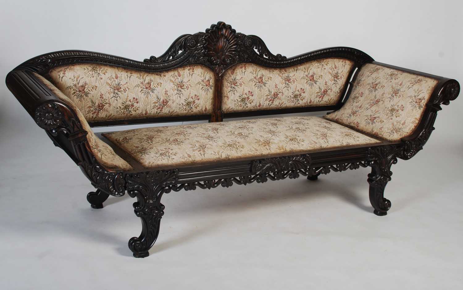 A 19th century Anglo-Indian coromandel sofa, the upright back centred with a shell carved motif