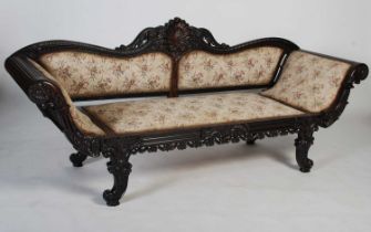 A 19th century Anglo-Indian coromandel sofa, the upright back centred with a shell carved motif