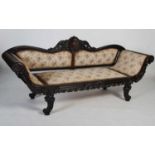A 19th century Anglo-Indian coromandel sofa, the upright back centred with a shell carved motif