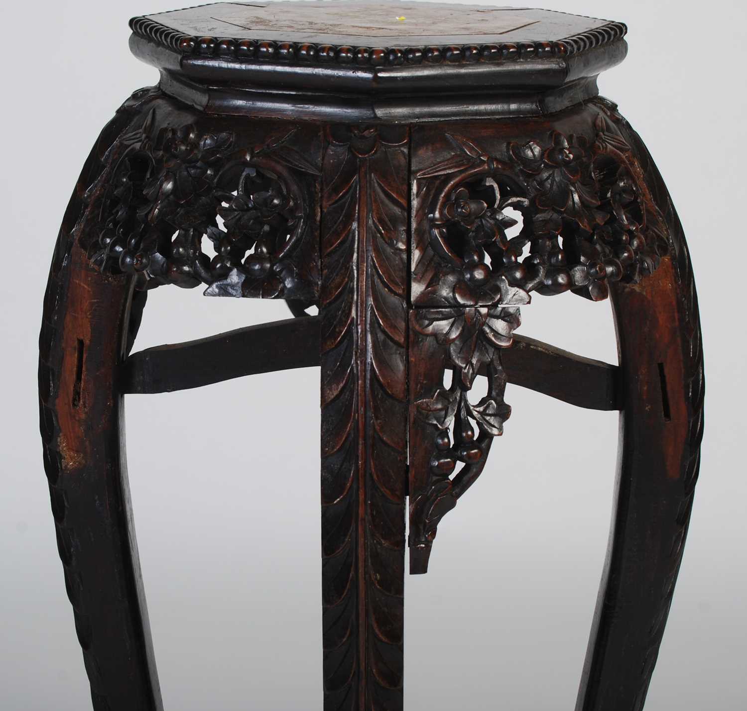 A Chinese dark wood urn stand, late 19th/ early 20th century, the octagonal-shaped top centred - Image 5 of 7