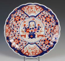 A Japanese Imari porcelain charger, late 19th / early 20th century, centred with a roundel enclosing