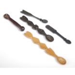 A group of five Scottish treen snuff spoons of various shapes and sizes, to include one of shaped