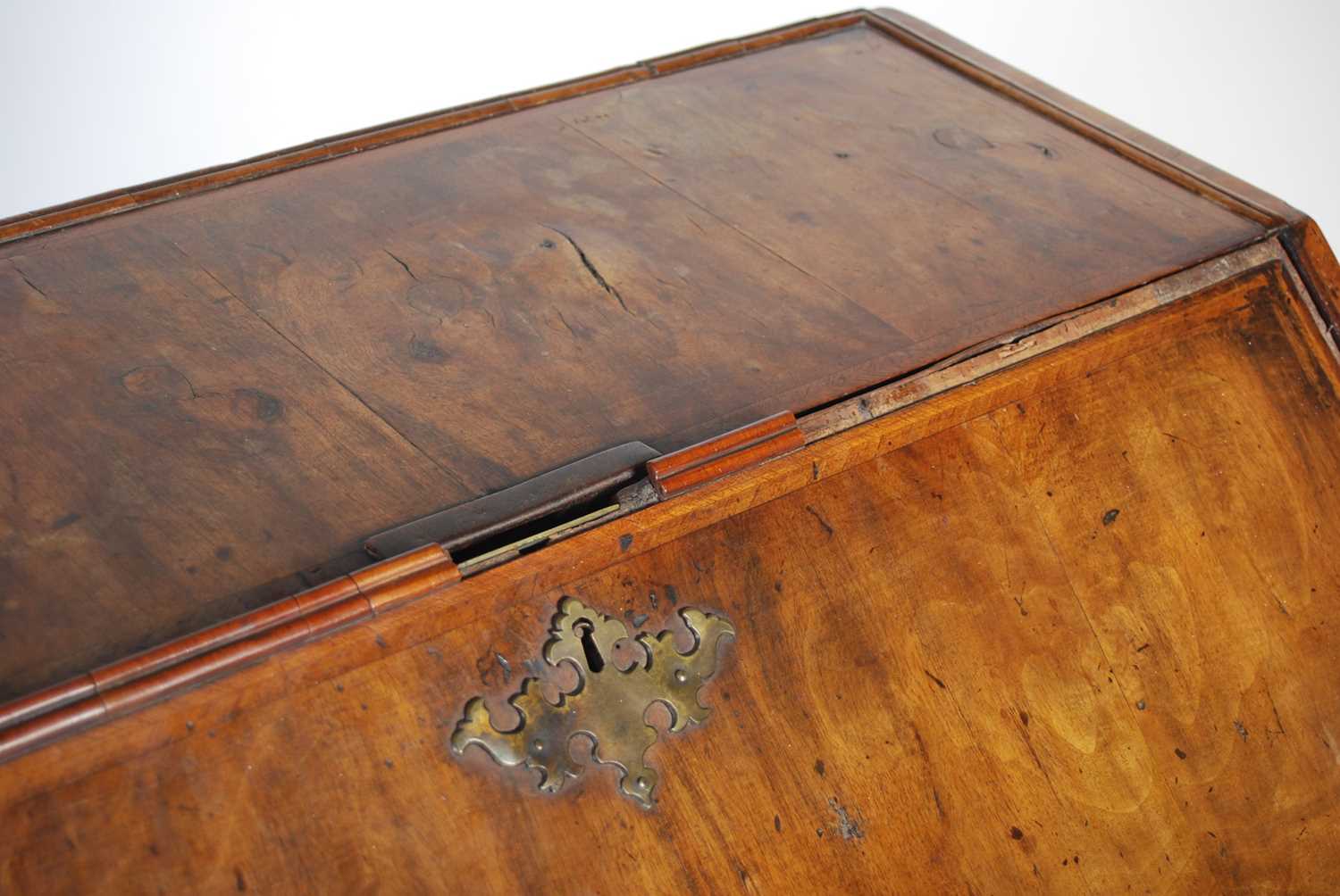 A George II walnut bureau, the rectangular fall-front opening and resting on loppers, to a fitted - Image 3 of 13