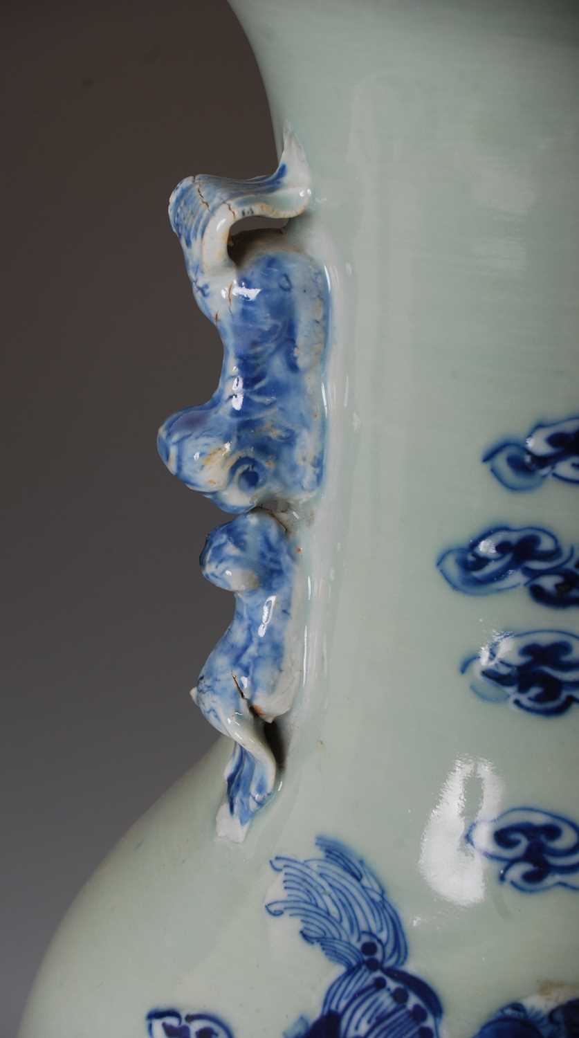 A large Chinese porcelain celadon ground vase, Qing Dynasty, decorated with shishi and five cubs, - Image 4 of 8