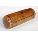 An unusual octagonal cylindrical burr yew wood snuff box with black penwork edges, one end sliding