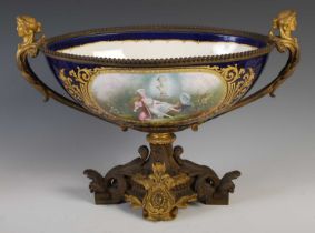 A late 19th century French ormolu mounted porcelain table centrepiece, the oval porcelain bowl