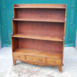 A 19th century mahogany waterfall bookcase, with four open shelves over three small drawers,