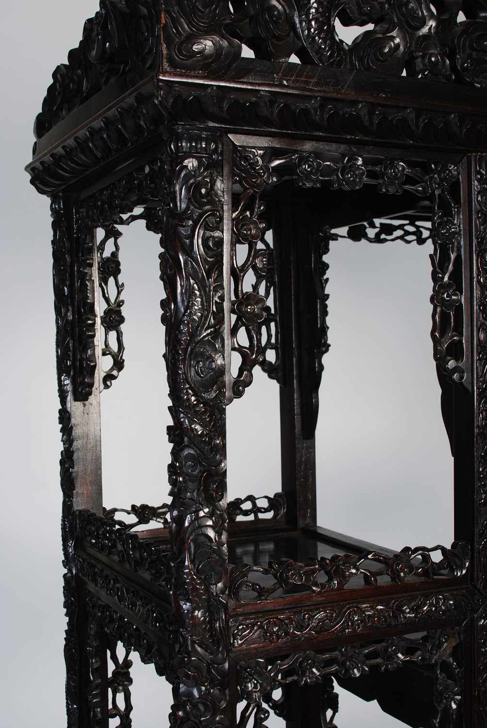 A late 19th century Chinese dark wood open display cabinet, with carved and pierced surmount of - Image 2 of 8