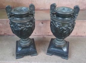 A pair of French bronze classical urns, after the Antique, based on the Townley vase, cast in relief