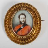 A Victorian yellow metal portrait brooch/ locket, enclosing a half-length portrait of a Military