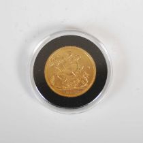 An Edward VII gold sovereign, dated 1904.