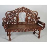 A Chinese dark wood and marble high-backed bench, late 19th/ early 20th century, the upright back