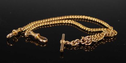 A 9ct gold curb link Albert chain with T-bar suspension, 38cm long, 30.8 grams.