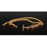 A 9ct gold curb link Albert chain with T-bar suspension, 38cm long, 30.8 grams.