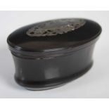 A tortoiseshell oval upright snuff box with incurved sides, the cover with silver stand-off hinge