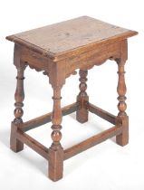 A George III oak joynt stool, the rectangular top with moulded edge above a shaped frieze raised