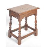 A George III oak joynt stool, the rectangular top with moulded edge above a shaped frieze raised