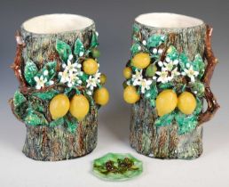 A rare pair of early 20th century Menton pottery 'Lemons' vases, of tree trunk form decorated in
