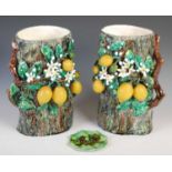 A rare pair of early 20th century Menton pottery 'Lemons' vases, of tree trunk form decorated in