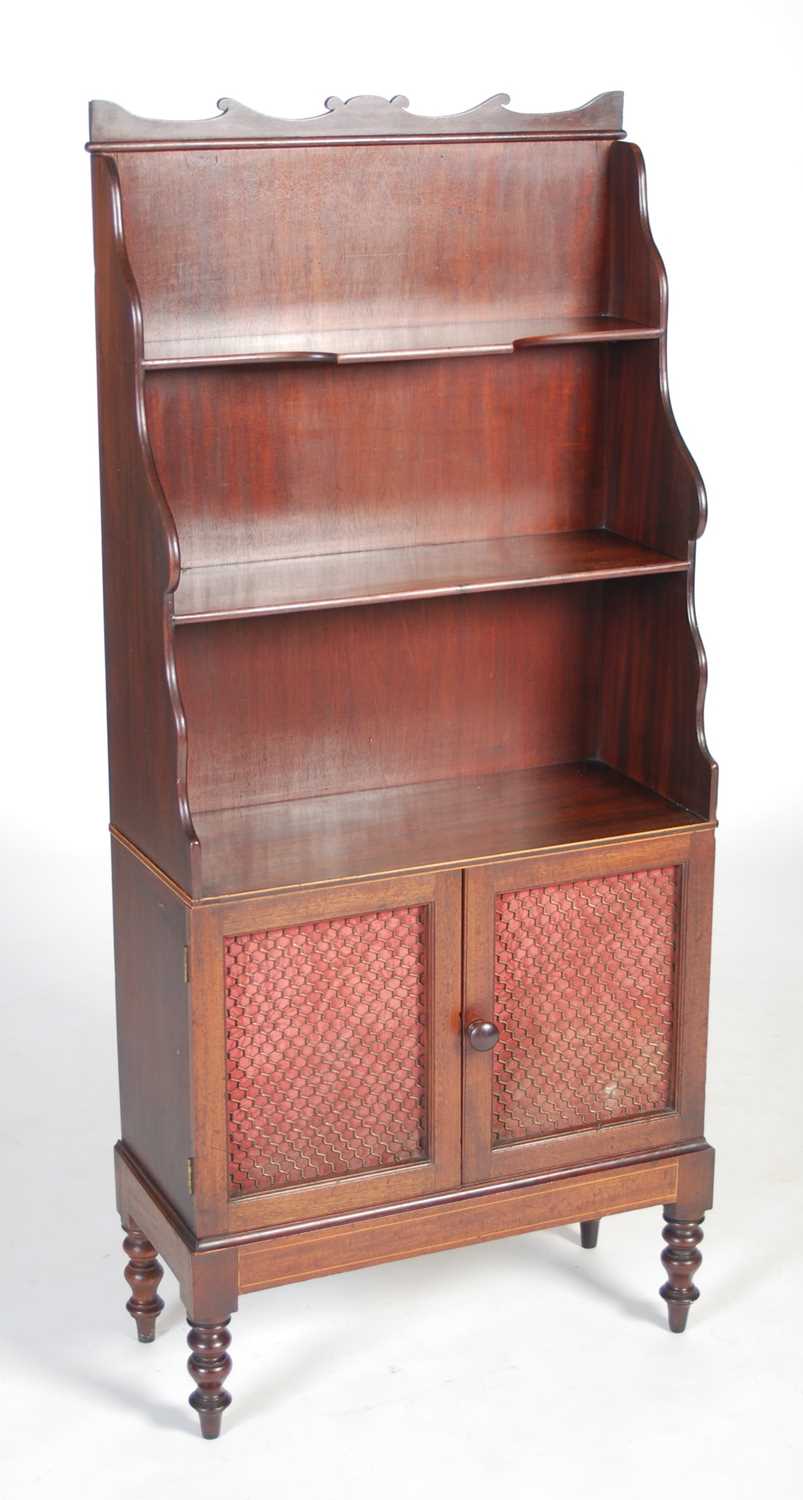 A 19th century Regency style mahogany waterfall bookcase, fitted with three graduated open shelves