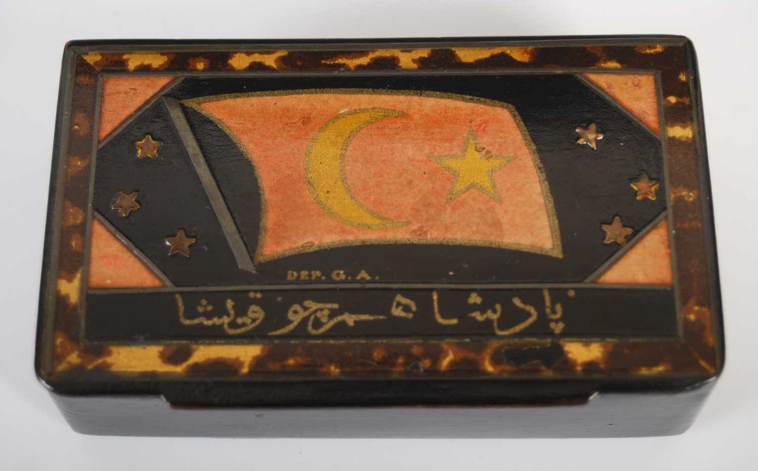 A black lacquer papier-mâché oblong snuff box, the hinged cover painted with a flag, star and - Image 3 of 4