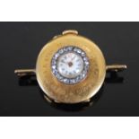 Golay Fils & Stahl, Geneve, a yellow metal and diamond set brooch watch, the white enamel dial